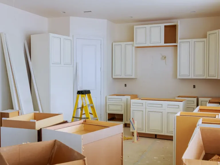 Kitchen renovation in progress with new cabinets being installed