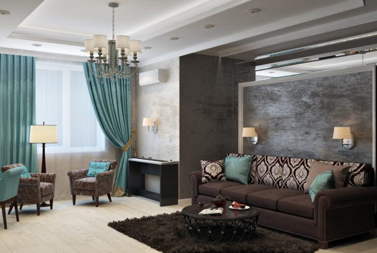 Modern elegant living room design by Legacy Built Homes featuring a dark brown sofa, textured accent wall, crystal chandelier, and teal curtains.